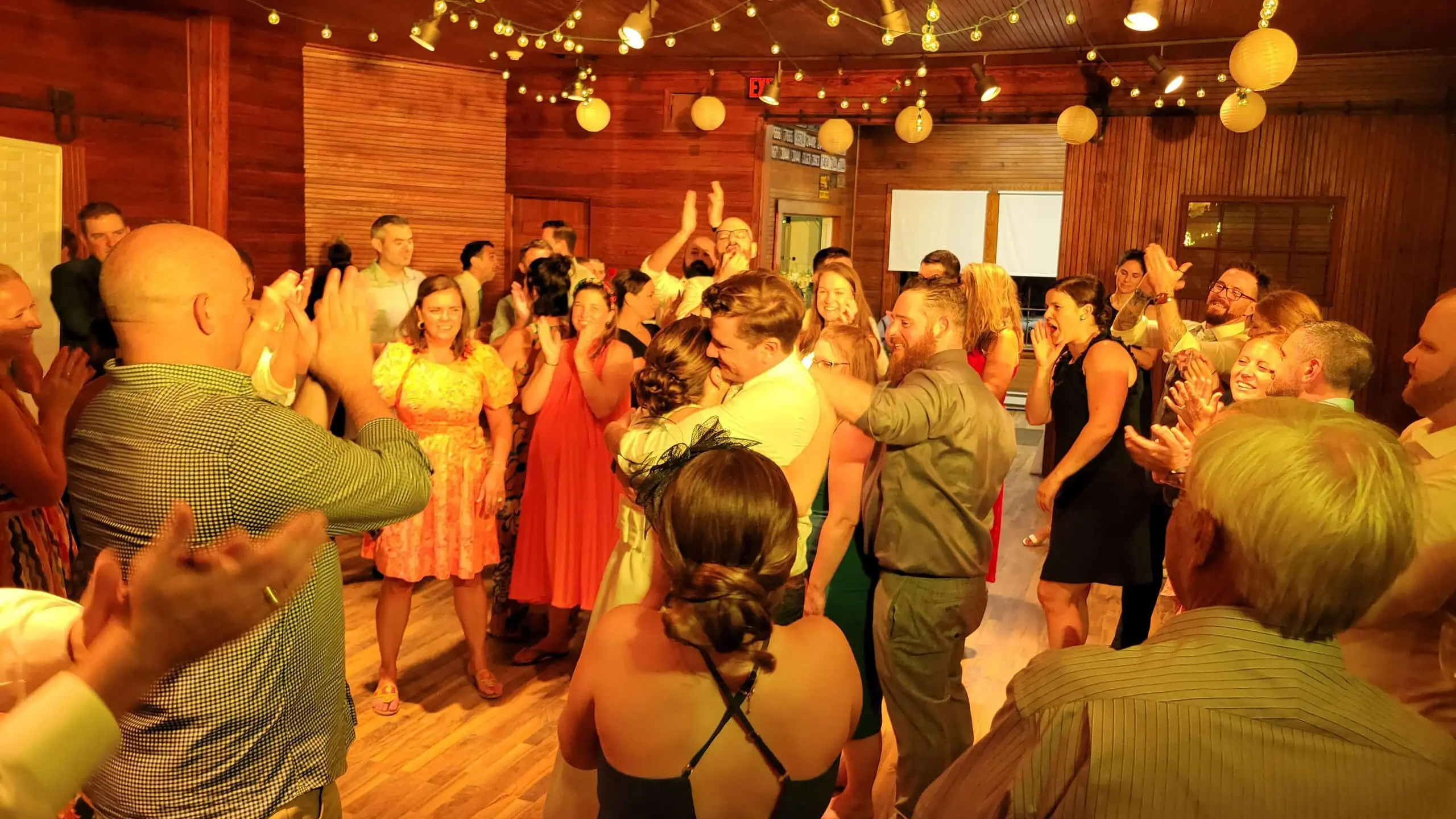 Wedding reception venue with warm lighting and table settings