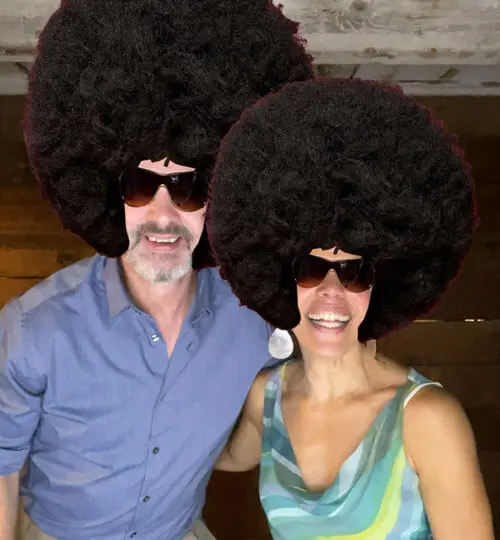 Guests posing with props in the Elation photo booth at a Massachusetts wedding